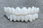FlexiSmile Dentures with Natural White Lenses for a Comfortable and Elegant Smile 1